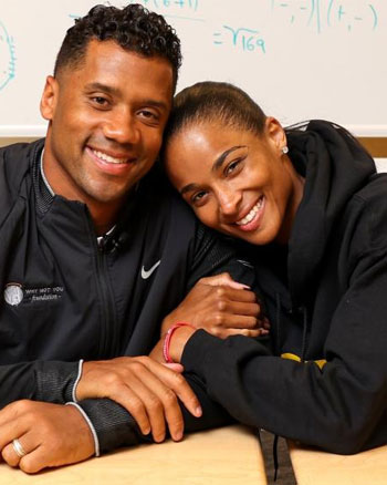 Ciara and Russell Wilson smiling together, co-authors of the children’s book Why Not You?, inspiring kids to dream big and achieve their goals.